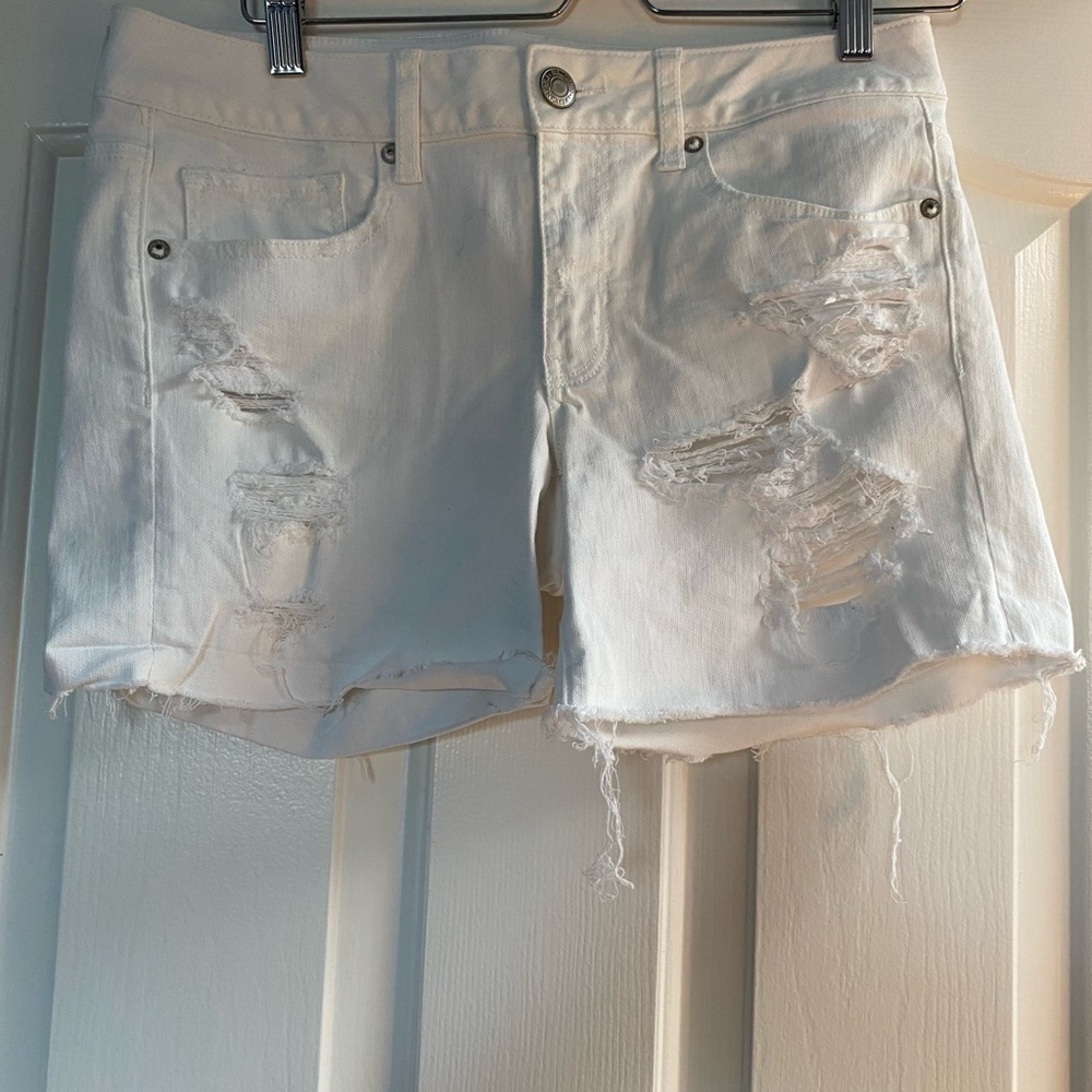 White ripped jean shorts